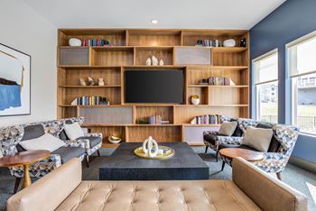 Clubhouse including Business Center and Sporting Room featuring Shuffleboard and Billiards